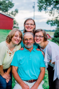 Grabau Family, Father surrounded by his three lovely adult daughters